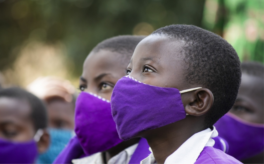 children wearing purple masks