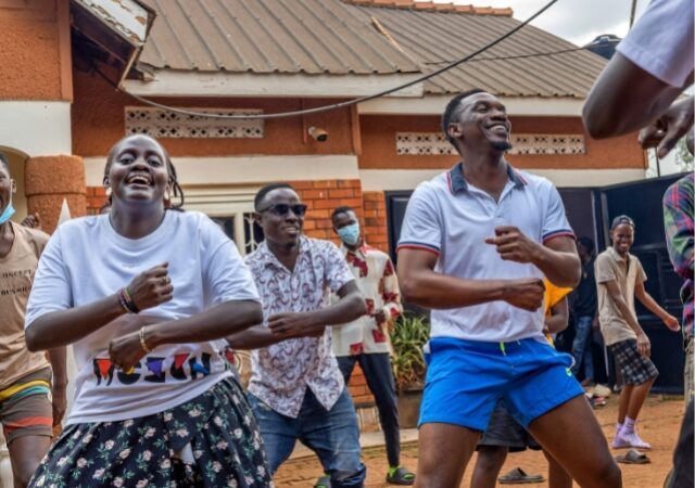 people dancing in a courtyard