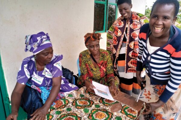 women in uganda working on a quilt