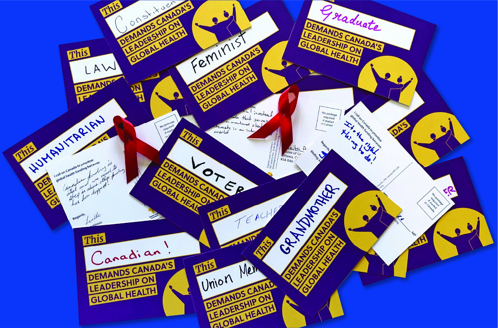 Postcards signed by Canadians, with messages to their MPs, and AIDS ribbons